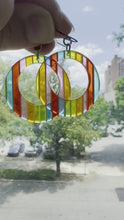 Load and play video in Gallery viewer, Vintage Semi Translucent Rainbow Flat Lucite Open Circle Earrings
