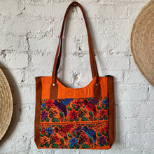 Load image into Gallery viewer, 1990s Orange Canvas &amp; Faux Suede Tote Bag with Cross Stitch Floral &amp; Hummingbird Embroidery

